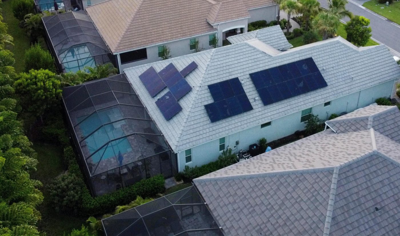 Aerial view of a residential rooftop solar array installed by Core Eleven